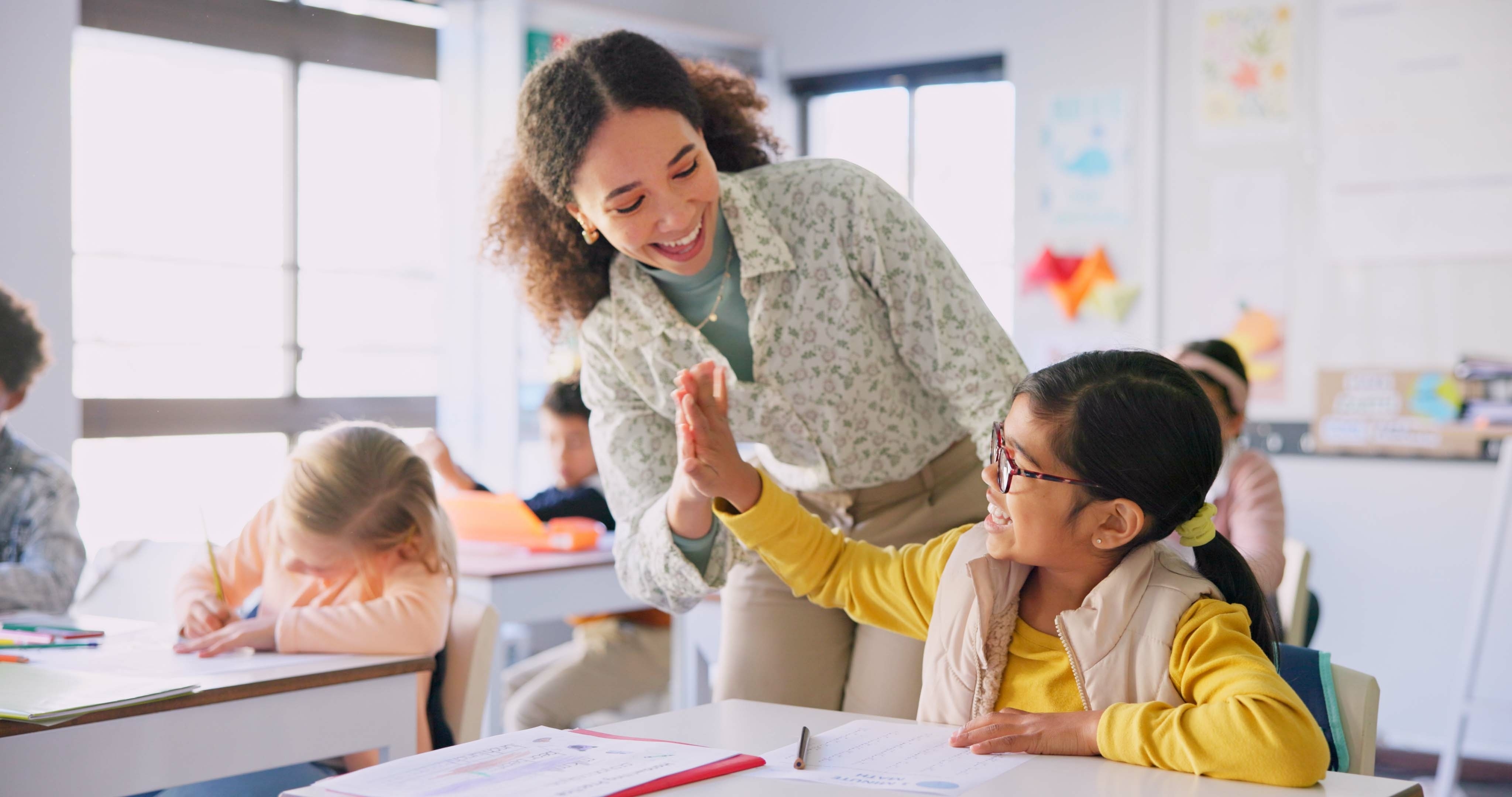 Teachers celebrating successful substitute coverage